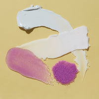White and pink textured object on a beige background